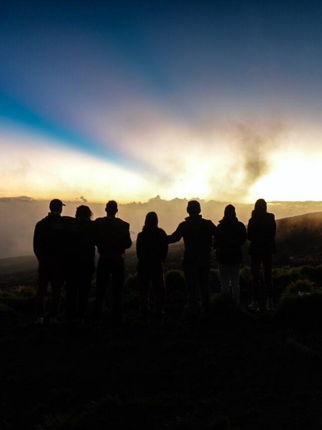 Life Happens Outdoors group watching sunrise in the mountains, representing editorial accountability and community feedback.