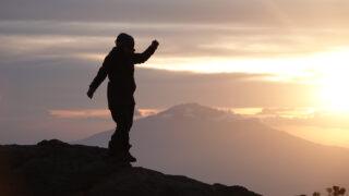 Life Happens Outdoors team member on a mountain ridge at sunrise, representing human-led editorial standards and expert review.