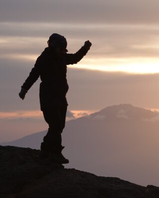 Life Happens Outdoors team member on a mountain ridge at sunrise, representing human-led editorial standards and expert review.
