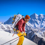 Ski mountaineer ascending a Himalayan snow slope during a Mera Peak ski touring expedition in Nepal