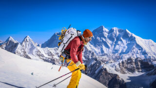 Ski mountaineer ascending a Himalayan snow slope during a Mera Peak ski touring expedition in Nepal